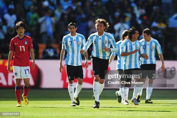 Gabriel Heinze of Argentina celebrates an own goal by Park Chu-Young of South Korea during the 2010 FIFA World Cup South Africa Group B match between...