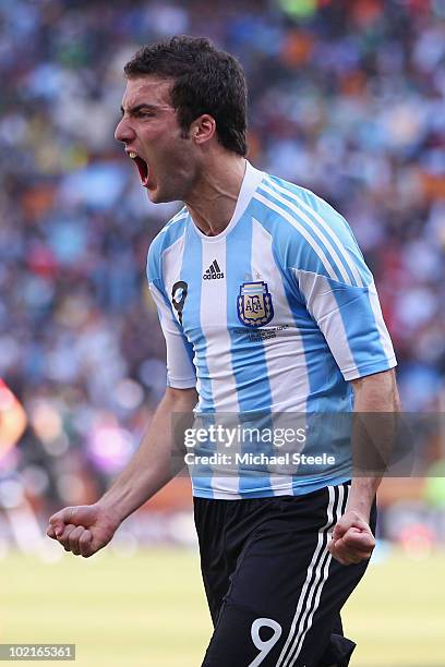 Gonzalo Higuain of Argentina celebrates scoring his side's second goal during the 2010 FIFA World Cup South Africa Group B match between Argentina...