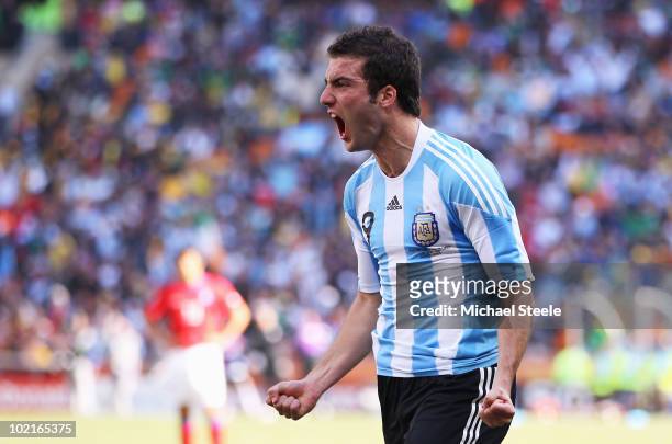 Gonzalo Higuain of Argentina celebrates scoring his side's second goal during the 2010 FIFA World Cup South Africa Group B match between Argentina...