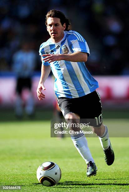 Lionel Messi of Argentina runs with the ball during the 2010 FIFA World Cup South Africa Group B match between Argentina and South Korea at Soccer...