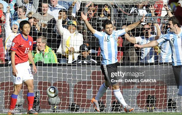 Argentina's striker Sergio Aguero celebrates with Argentina's striker Gonzalo Higuain after Higuain scored his third goal of the match during their...
