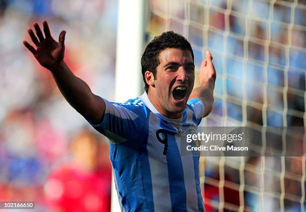 Gonzalo Higuain of Argentina celebrates scoring his third goal and his side's fourth during the 2010 FIFA World Cup South Africa Group B match...
