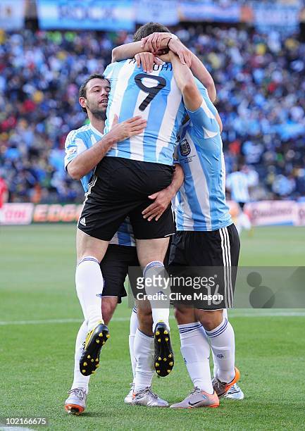 Javier Mascherano and Sergio Aguero of Argentina celebrate the third goal by Gonzalo Higuain of Argentina during the 2010 FIFA World Cup South Africa...