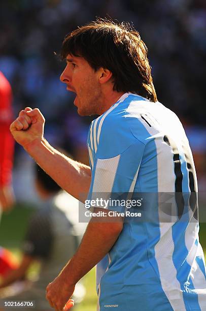 Lionel Messi of Argentina celebrates after team mate Gonzalo Higuain scores during the 2010 FIFA World Cup South Africa Group B match between...