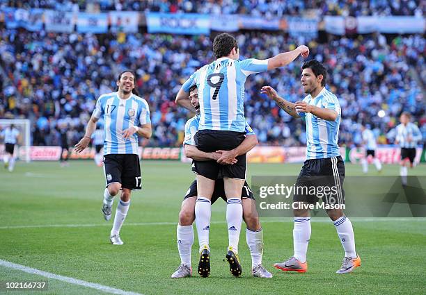 Javier Mascherano and Sergio Aguero of Argentina celebrate the third goal by Gonzalo Higuain of Argentina during the 2010 FIFA World Cup South Africa...