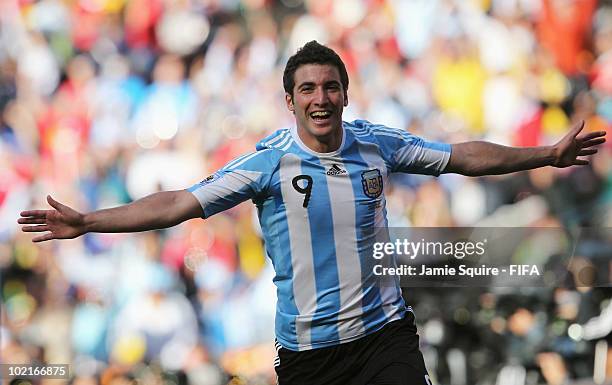 Gonzalo Higuain of Argentina celebrates scoring his team's fourth goal during the 2010 FIFA World Cup South Africa Group B match between Argentina...