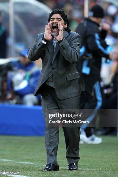 Diego Maradona head coach of Argentina urges his team during the 2010 FIFA World Cup South Africa Group B match between Argentina and South Korea at...