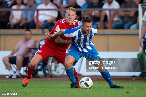 Lewis Holtby of Hamburger SV and Admir Terzic of TuS Erndtebrueck battle for the ball during the DFB Cup first round match between TuS Erndtebrueck...