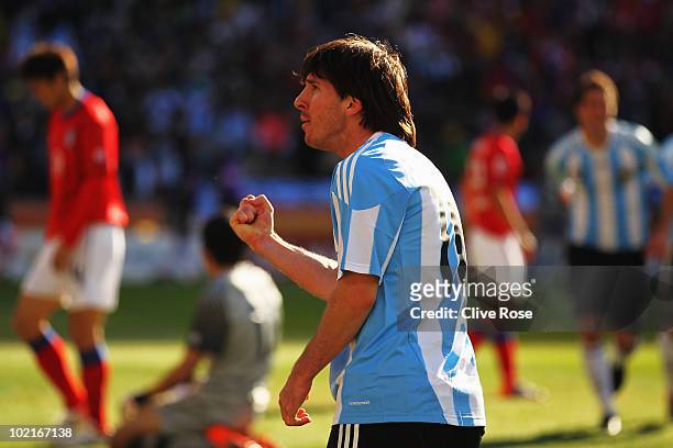 Lionel Messi of Argentina celebrates after team mate Gonzalo Higuain scores his isde's third goal during the 2010 FIFA World Cup South Africa Group B...