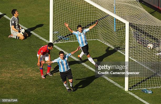Gonzalo Higuain of Argentina celebrates scoring his second goal with team mate Sergio Aguero during the 2010 FIFA World Cup South Africa Group B...