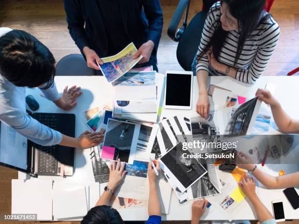 magazine editors at work. - publication plan stock pictures, royalty-free photos & images