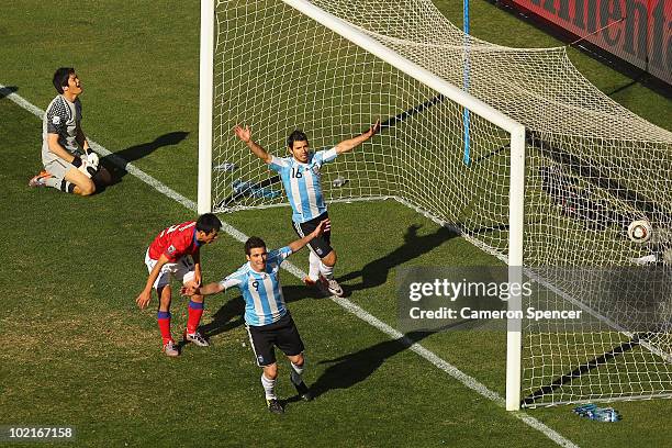 Gonzalo Higuain of Argentina celebrates scoring his second goal with team mate Sergio Aguero during the 2010 FIFA World Cup South Africa Group B...