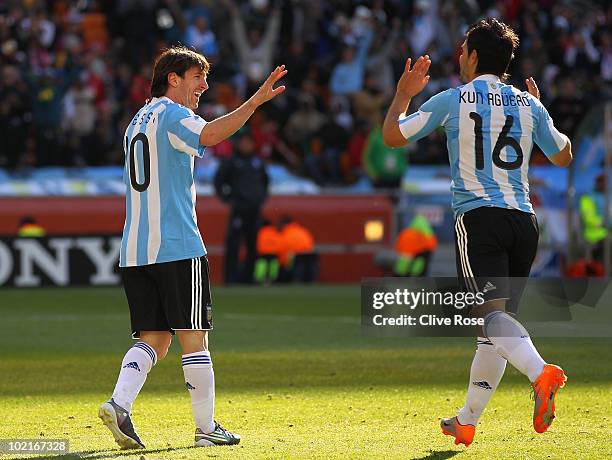 Lionel Messi of Argentina celebrates with Sergio Aguero of Argentina during the 2010 FIFA World Cup South Africa Group B match between Argentina and...