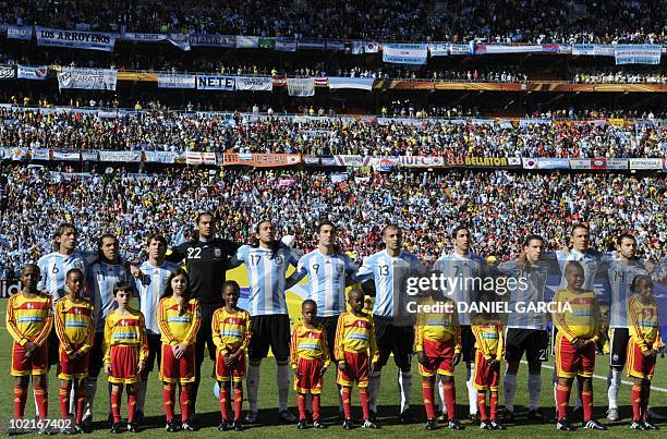 Argentina's defender Gabriel Heinze, Argentina's striker Carlos Tevez, Argentina's striker Lionel Messi, Argentina's goalkeeper Sergio Romero,...