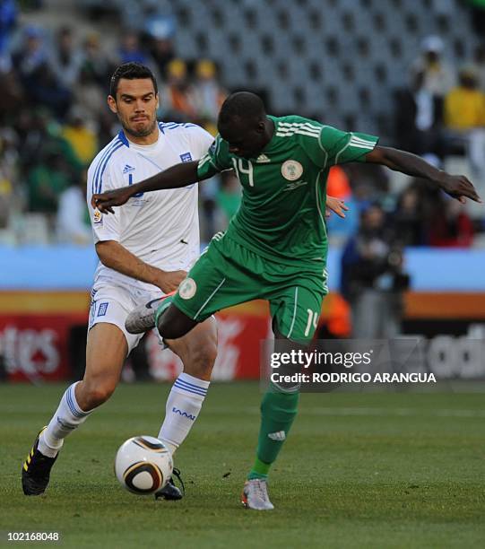 Nigeria's midfielder Sani Kaita shoots the ball ahead of Greece's midfielder Alexandros Tziolis during the Group B first round 2010 World Cup...