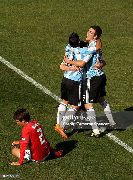 Gonzalo Higuain of Argentina celebrates scoring a goal with Sergio Aguero of Argentina during the 2010 FIFA World Cup South Africa Group B match...