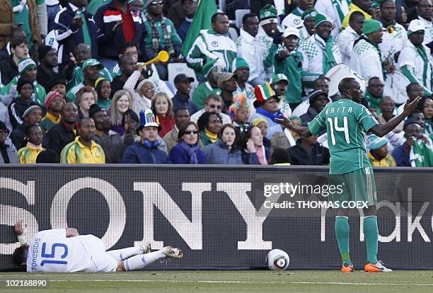 Greece's defender Vasilis Torosidis lies on the pitch after Nigeria's midfielder Sani Kaita kicked him during the Group B first round 2010 World Cup...