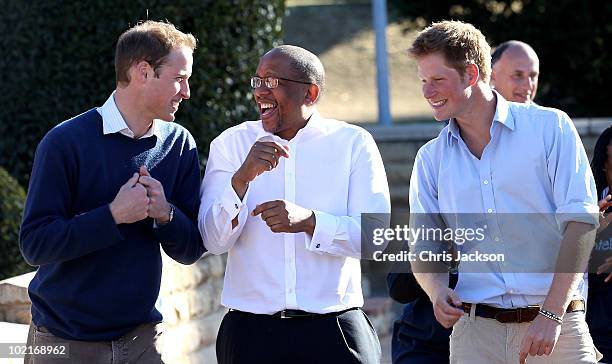 Prince Harry and Prince William dance with Prince Seeiso as they visit the Mamahato Network Club for children affected by HIV at King Letsie's Palace...