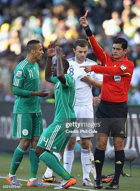 Sani Kaita of Nigeria is shown a red card by referee Oscar Ruiz during the 2010 FIFA World Cup South Africa Group B match between Greece and Nigeria...
