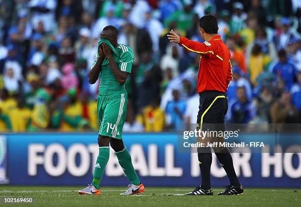 Sani Kaita of Nigeria is sent off by referee Oscar Ruiz during the 2010 FIFA World Cup South Africa Group B match between Greece and Nigeria at the...