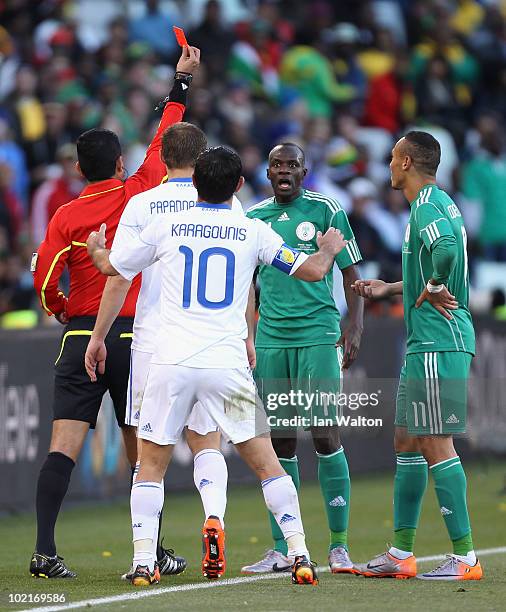 Sani Kaita of Nigeria is stunned as he is shown a red card by referee Oscar Ruiz during the 2010 FIFA World Cup South Africa Group B match between...