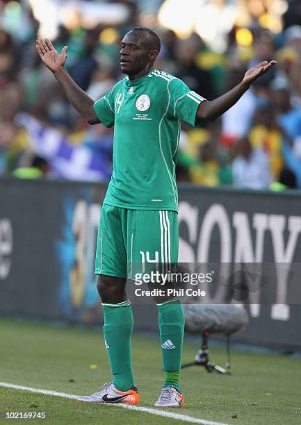 Sani Kaita of Nigeria pleads his innocence as he is shown a red card during the 2010 FIFA World Cup South Africa Group B match between Greece and...