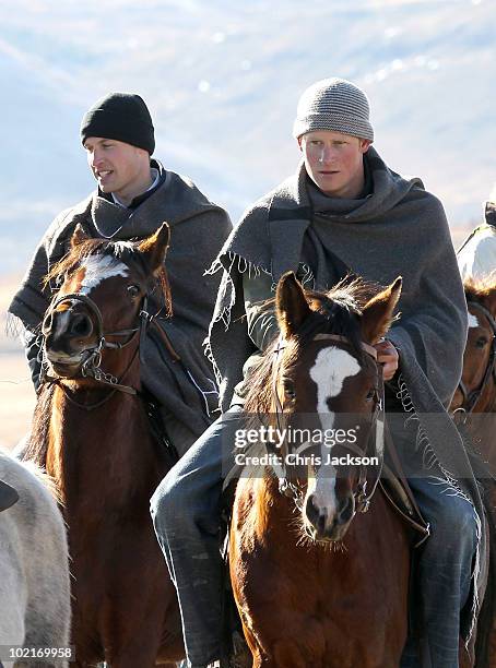 Prince Harry and Prince William ride horses as they arrive to visit a child education centre on June 17, 2010 in Semonkong, Lesotho. The two Princes...