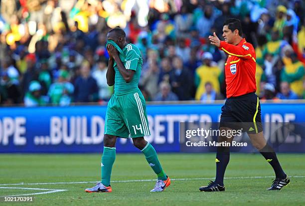 Sani Kaita of Nigeria is sent off by referee Oscar Ruiz during the 2010 FIFA World Cup South Africa Group B match between Greece and Nigeria at the...
