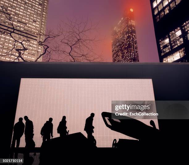 people looking at temporary car display in front of illuminated skyline - exposition wall stockfoto's en -beelden