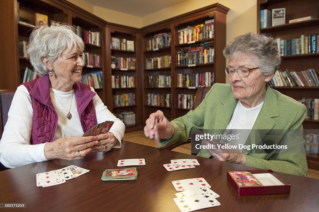 Senior women playing cards