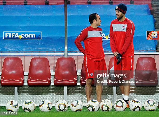 Clint Dempsey and Landon Donovan of USA prepare for a training session at Ellis Park on June 17, 2010 in Johannesburg, South Africa. USA will play...