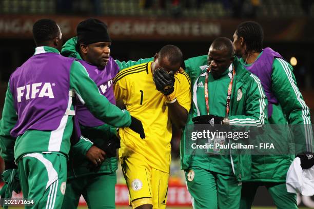 Goalkeeper Vincent Enyeama of Nigeria is comorted by team mates after defeat in the 2010 FIFA World Cup South Africa Group B match between Greece and...
