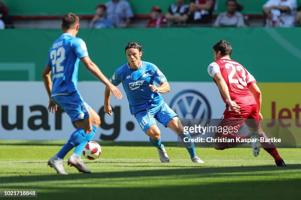 Nico Schulz of Hoffenheim challenges Florian Dick of Kaiserslautern during the first round DFB Cup match between 1. FC Kaiserslautern and TSG 1899...