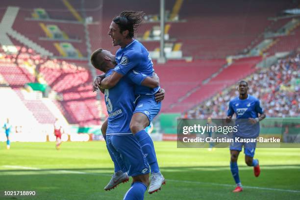 Nico Schulz of Hoffenheim, Pavel Kaderabek of Hoffenheim and Joelinton of Hoffenheim celebrates the second goal for Hoffenheim during the first round...