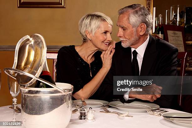 senior couple staring into each other's eyes - happy anniversary stock-fotos und bilder