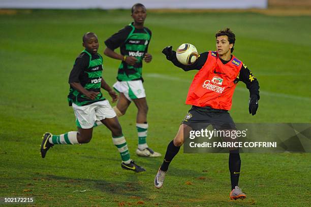 Brazil's striker Nilmar controls the ball during a match against a local club during a training session at the Randburg High School on June 17, 2010...