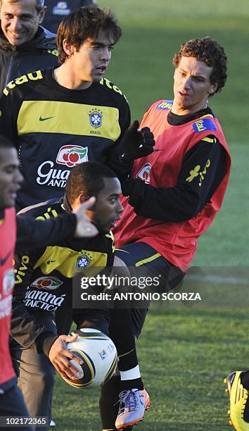 Brazil's Daniel Alves , Kaka, Robinho and Elano fights for the ball during a training session at Randburg High School, June 17, 2010 in Johannesburg....