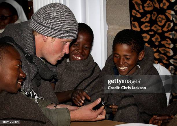 Prince Harry meets children at St Leonard's Herd Boy School on June 16, 2010 in Semonkong, Lesotho. The two Princes are on a joint trip to Africa...