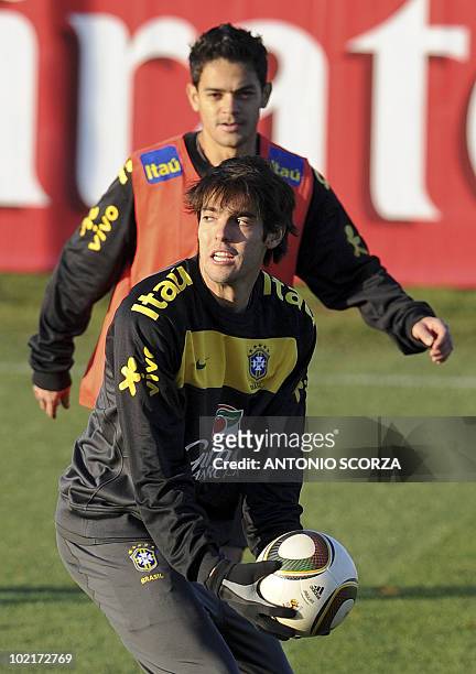 Brazil's Kaka and Josue warm up during a training sesssion at Randburg High School on June 17, 2010 in Johannesburg. Brazil's team prepares to face...