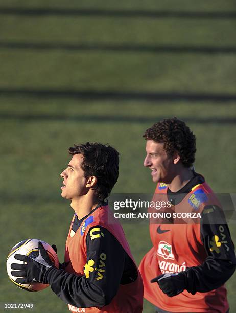 Brazil's Nilmar and Elano warm up during a training sesssion at Randburg High School on June 17, 2010 in Johannesburg. Brazil's team prepares to face...