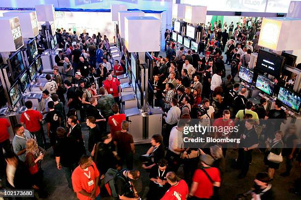 Attendees try games made by Electronic Arts Inc. On various gaming systems during the Electronic Entertainment Expo in Los Angeles, California, U.S.,...