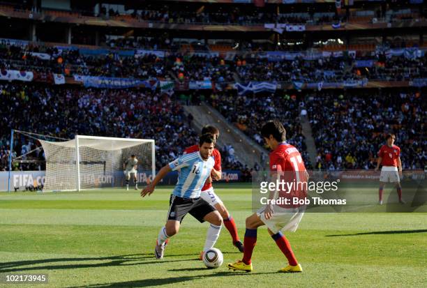 Sergio Aguero of Argentina is faced by Lee Chung-Yong of South Korea during the 2010 FIFA World Cup South Africa Group B match between Argentina and...