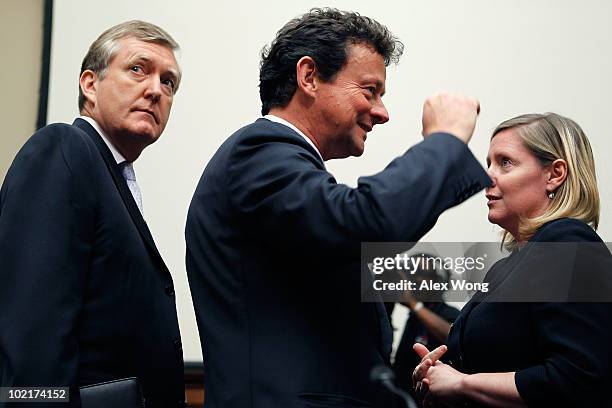 Chief Executive Tony Hayward talks with members of his entourage during a break in testimony before the Oversight and Investigations Subcommittee...