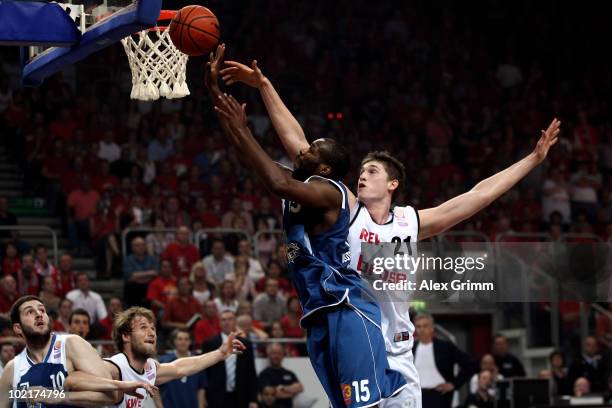 Derrick Allen of Frankfurt is challenged by Tibor Pleiss of Brose Baskets during game five of the Beko Basketball Bundesliga play off finals between...