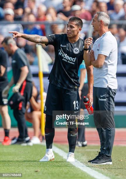 Carlos Salcedo of Eintracht Frankfurt speaks with Head coach Adi Huetter of Eintracht Frankfurt during the DFB Cup first round match between SSV Ulm...