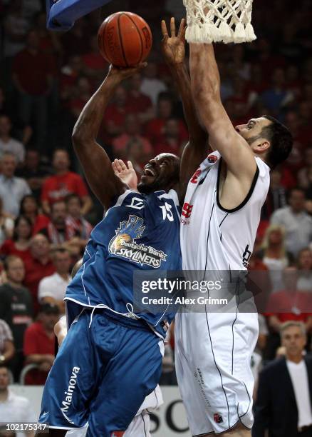 Derrick Allen of Frankfurt is challenged by Predrag Suput of Brose Baskets during game five of the Beko Basketball Bundesliga play off finals between...