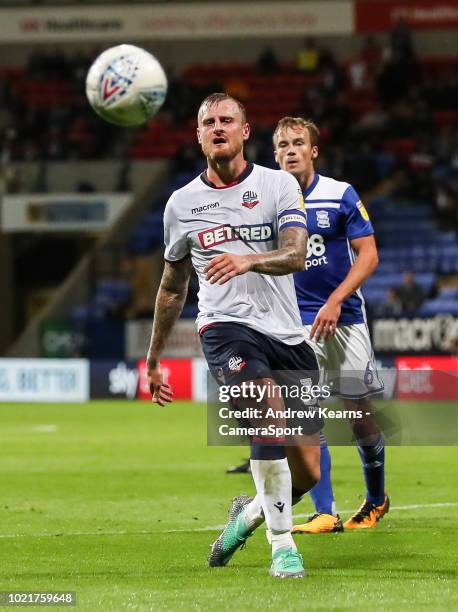 Bolton Wanderers' David Wheater plays a through ball as Birmingham City's Maikel Kieftenbeld looks on during the Sky Bet Championship match between...