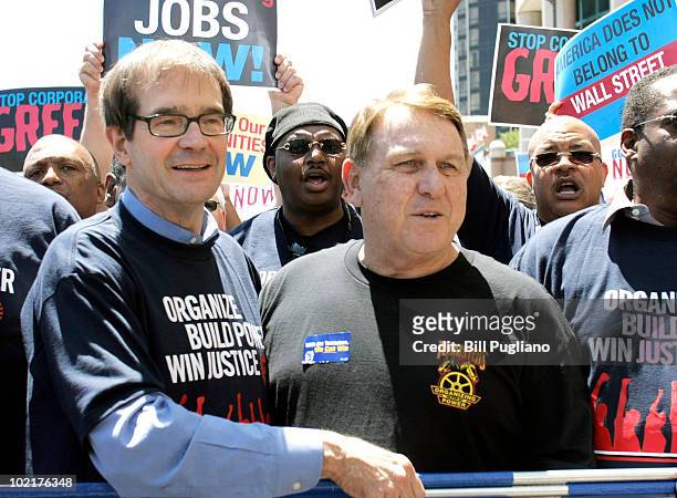 Newly-elected United Auto Workers president Bob King and Teamsters President James Hoffa prepare to march through downtown Detroit after the closing...