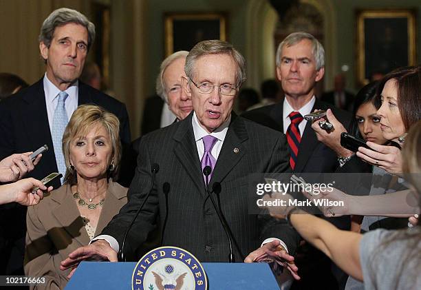 Senate Majority Leader Harry Reid speaks while flanked by Sen. John Kerry , Sen. Barbara Boxer , Sen. Joe Lieberman , Sen. Jeff Bingaman , and Sen....