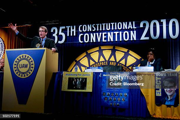 Bob King, the new president of the United Auto Workers union , left, addresses the UAW 35th Constitutional Convention at Cobo Hall in Detroit,...